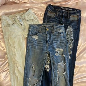 3 pair distressed American Eagle Jeans lot size 00 light medium dark wash denim